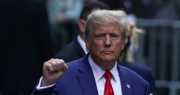 FILE PHOTO: Former U.S. President Donald Trump gestures to his supporters, on the day of the closing arguments in the Trump Organization civil fraud trial, outside a Trump property in the Manhattan borough of New York City, U.S., January 11, 2024. REUTERS/David Dee Delgado/File Photo/David Dee Delgado