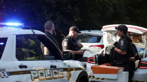 Police officers stand outside the home of the former White House national security adviser John Bolton as it is searched by FBI members, in Bethesda, Maryland, U.S., August 22, 2025. REUTERS/Tasos Katopodis/Tasos Katopodis