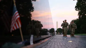 Members of the National Guard walk through the Vietnam Veterans Memorial on the National Mall after U.S. President Donald Trump deployed the National Guard and ordered an increased presence of federal law enforcement to assist in crime prevention, in Washington, D.C., U.S., August 23, 2025. REUTERS/Jose Luis Gonzalez/Jose Luis Gonzalez