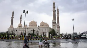 People pass by during a demonstration in solidarity with Palestinians, in Sanaa, Yemen August 1, 2025. REUTERS/Khaled Abdullah/Khaled Abdullah