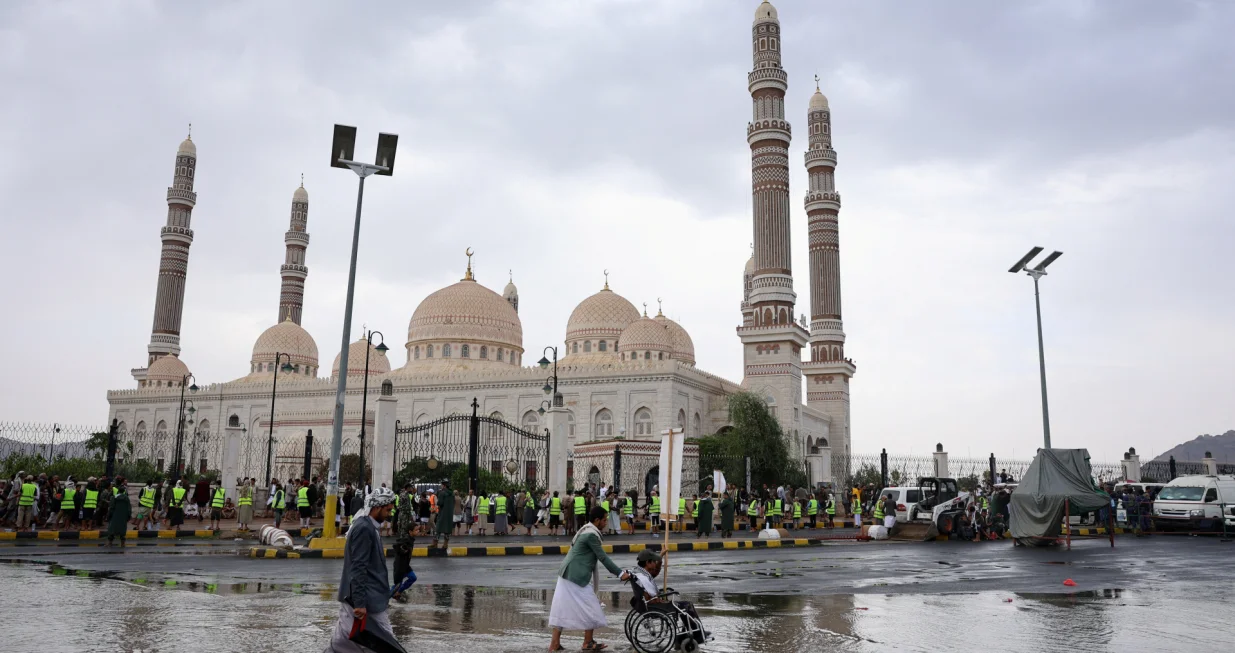 People pass by during a demonstration in solidarity with Palestinians, in Sanaa, Yemen August 1, 2025. REUTERS/Khaled Abdullah/Khaled Abdullah