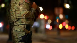 A member of the Ohio National Guard wears his sidearm while patrolling in the Logan Circle neighborhood, weeks after U.S. President Donald Trump ordered National Guard and law enforcement to patrol the nation's capital to assist in crime prevention, in Washington, D.C., U.S., August 24, 2025. REUTERS/Jose Luis Gonzalez/Jose Luis Gonzalez
