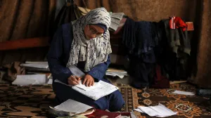 Displaced 19-year-old Palestinian student of Gaza's Azhar Institute, Saja Adwan, studies at a damaged school building being used as a shelter for displaced families, in Gaza City, May 28, 2025. REUTERS/Dawoud Abu Alkas/Dawoud Abu Alkas
