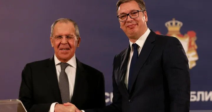 epa09517266 Serbian President Aleksandar Vucic (R) shakes hands with Russian Foreign Minister Sergei Lavrov (L) after their meeting in Belgrade, Serbia, 10 October 2021. Foreign Minister Lavrov is on an official visit to Serbia. EPA/ANDREJ CUKIC/Andrej Cukic