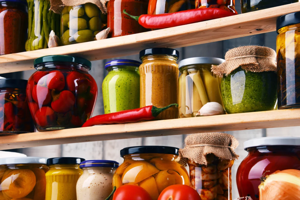 Jars with variety of pickled vegetables. Preserved food/