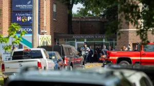 Police and medical teams work the scene after a shooting at Annunciation Church, which is also home to an elementary school, in Minneapolis, Minnesota, U.S. August 27, 2025. REUTERS/Ben Brewer/Ben Brewer