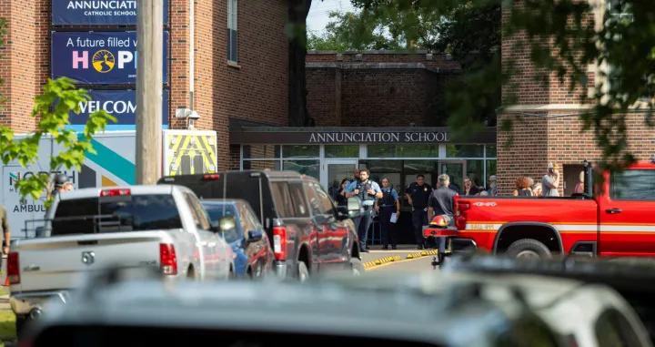 Police and medical teams work the scene after a shooting at Annunciation Church, which is also home to an elementary school, in Minneapolis, Minnesota, U.S. August 27, 2025. REUTERS/Ben Brewer/Ben Brewer