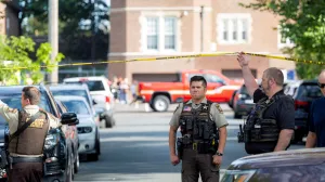 An officer with the Hennepin County Sheriff looks on outside a shooting at Annunciation Church, which is also home to an elementary school, in Minneapolis, Minnesota, U.S. August 27, 2025. REUTERS/Ben Brewer/Ben Brewer