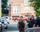 An officer with the Hennepin County Sheriff looks on outside a shooting at Annunciation Church, which is also home to an elementary school, in Minneapolis, Minnesota, U.S. August 27, 2025. REUTERS/Ben Brewer/Ben Brewer