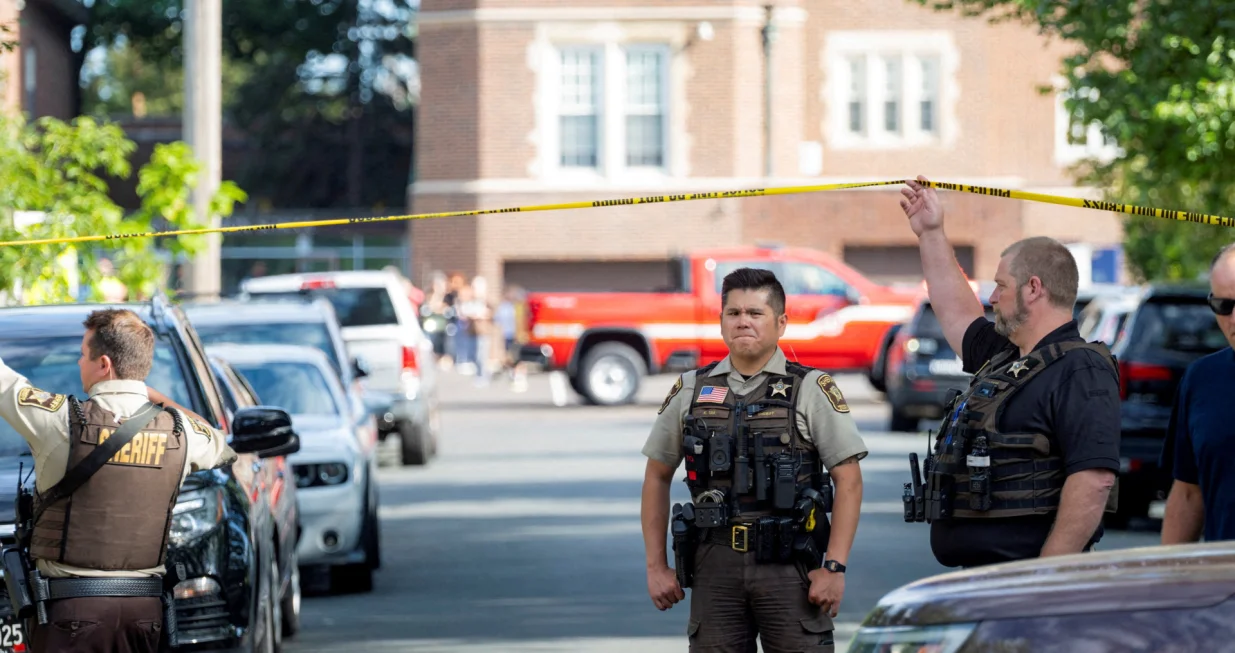 An officer with the Hennepin County Sheriff looks on outside a shooting at Annunciation Church, which is also home to an elementary school, in Minneapolis, Minnesota, U.S. August 27, 2025. REUTERS/Ben Brewer/Ben Brewer