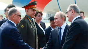Russian President Vladimir Putin shakes hands with officials during a welcoming ceremony at an airport upon his arrival for the Shanghai Cooperation Organisation (SCO) summit in Tianjin, China August 31, 2025. Sputnik/Vladimir Smirnov/Pool via REUTERS ATTENTION EDITORS - THIS IMAGE WAS PROVIDED BY A THIRD PARTY./Vladimir Smirnov