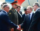 Russian President Vladimir Putin shakes hands with officials during a welcoming ceremony at an airport upon his arrival for the Shanghai Cooperation Organisation (SCO) summit in Tianjin, China August 31, 2025. Sputnik/Vladimir Smirnov/Pool via REUTERS ATTENTION EDITORS - THIS IMAGE WAS PROVIDED BY A THIRD PARTY./Vladimir Smirnov