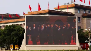 A screen shows Chinese President Xi Jinping, Russian President Vladimir Putin and North Korean leader Kim Jong Un arriving for a military parade to mark the 80th anniversary of the end of World War Two, in Beijing, China, September 3, 2025. REUTERS/Tingshu Wang REFILE - QUALITY REPEAT/Tingshu Wang