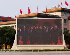 A screen shows Chinese President Xi Jinping, Russian President Vladimir Putin and North Korean leader Kim Jong Un arriving for a military parade to mark the 80th anniversary of the end of World War Two, in Beijing, China, September 3, 2025. REUTERS/Tingshu Wang REFILE - QUALITY REPEAT/Tingshu Wang