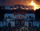 Flames rise from the burning Singha Durbar office complex that houses the Nepali prime minister's office and other ministries, amid a protest against Monday's killing of 19 people after anti-corruption protests that were triggered by a social media ban which was later lifted, during a curfew in Kathmandu, Nepal, September 9, 2025. REUTERS/Navesh Chitrakar  TPX IMAGES OF THE DAY/Navesh Chitrakar