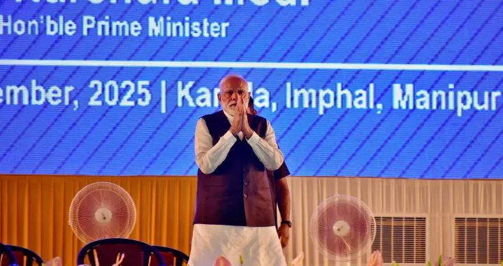 India's Prime Minister Narendra Modi greets supporters upon his arrival at a public meeting in Imphal, in the northeastern state of Manipur, India, September 13, 2025. REUTERS/Stringer/Stringer