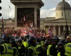 Protesters gather in Trafalgar Square on the day of an anti-immigration rally organised by British anti-immigration activist Stephen Yaxley-Lennon, also known as Tommy Robinson, in London, Britain, September 13, 2025. REUTERS/Jaimi Joy/Jaimi Joy