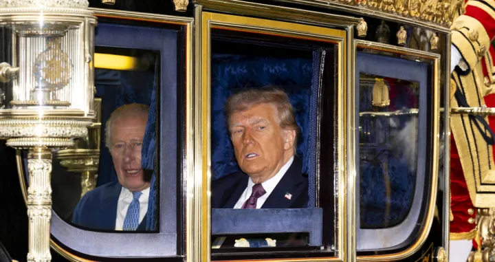 FILE PHOTO: King Charles III and US President Donald Trump sit during the carriage procession to Windsor Castle, Berkshire, ahead of the ceremonial welcome on day one of the US President's second state visit to the UK. Picture date: Wednesday September 17, 2025. Jordan Pettitt/Pool via REUTERS/File Photo/Jordan Pettitt