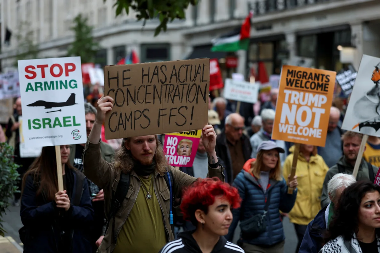 Demonstrators hold signs and placards on the day of a 'Trump Not Welcome' protest during the state visit of U.S. President Donald Trump and first lady Melania Trump, in London, Britain, September 17, 2025. REUTERS/Hannah McKay/Hannah Mckay