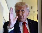U.S. President Donald Trump speaks to reporters aboard Air Force One on his return from a state visit in Britain, September 18, 2025. REUTERS/Kevin Lamarque/Kevin Lamarque