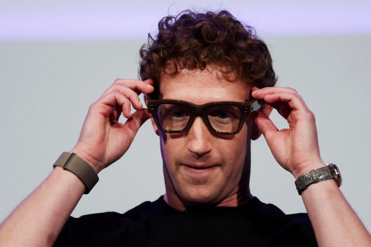 Meta CEO Mark Zuckerberg wears the Meta Ray-Ban Display glasses, as he delivers a speech presenting the new line of smart glasses, during the Meta Connect event at the company's headquarters in Menlo Park, California, U.S., September 17, 2025. REUTERS/Carlos Barria  TPX IMAGES OF THE DAY/Carlos Barria