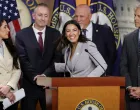 U.S. Representative Alexandria Ocasio-Cortez (D-NY), with Rep. Brian Fitzpatrick (R-PA), Rep. Anna Paulina Luna (R-FL), Rep. Chip Roy (R-TX) and Rep. Scott Perry (R-PA) smiles at a news conference with a bipartisan group of House members to say they are prepared to force a vote on legislation to ban members of Congress and their families from trading stocks on Capitol Hill in Washington, D.C., U.S., September 3, 2025. REUTERS/Jonathan Ernst/Jonathan Ernst