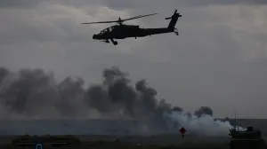 U.S. Apache military helicopter flies as Polish forces with NATO soldiers hold 'Iron Defender' military exercises, at a military range in Wierzbiny near Orzysz, Poland, September17, 2025. REUTERS/Kacper Pempel/Kacper Pempel