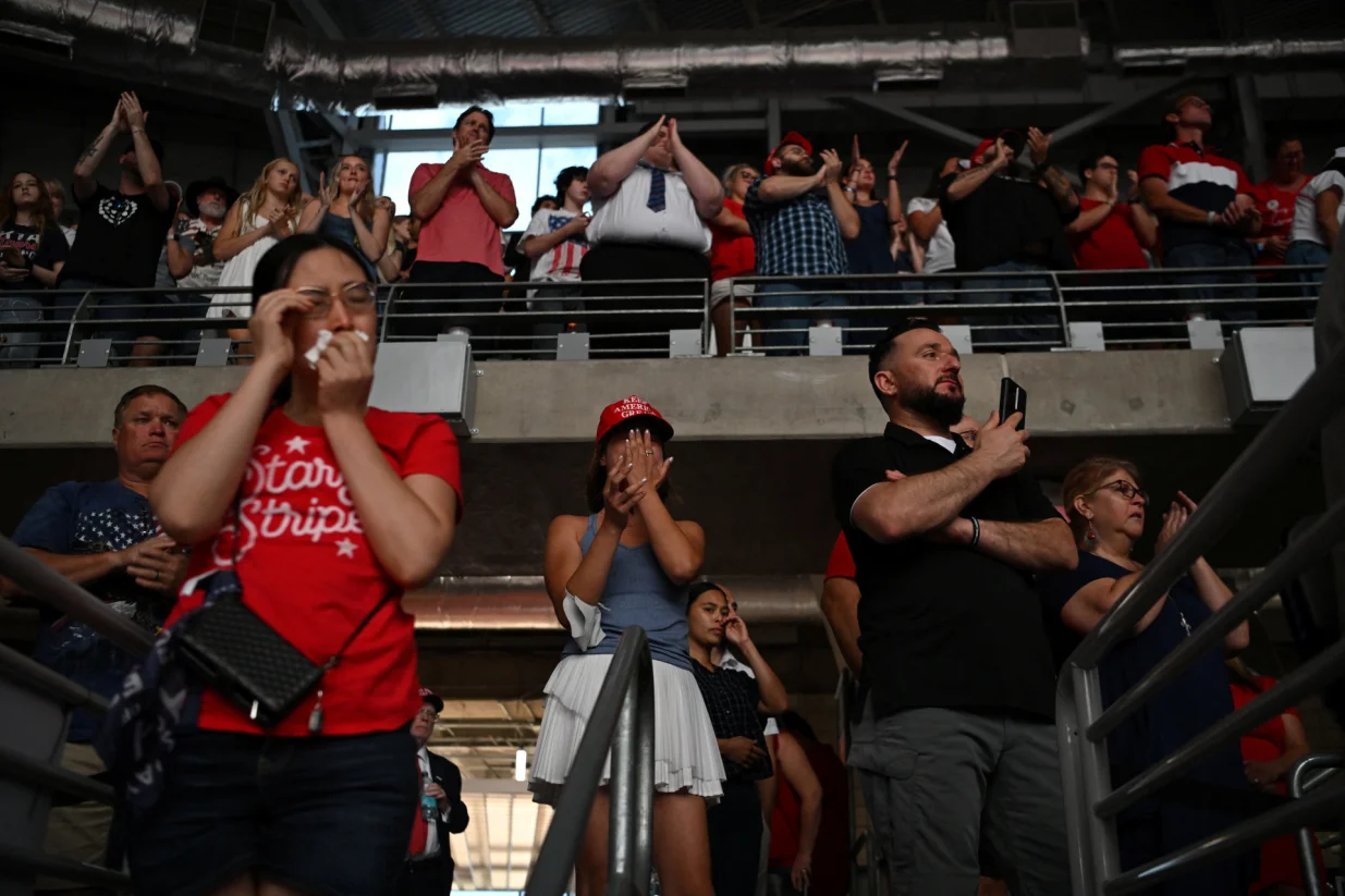 People react during a memorial service for slain conservative commentator Charlie Kirk at State Farm Stadium in Glendale, Arizona, U.S., September 21, 2025. REUTERS/Callaghan O'Hare/Callaghan O'hare