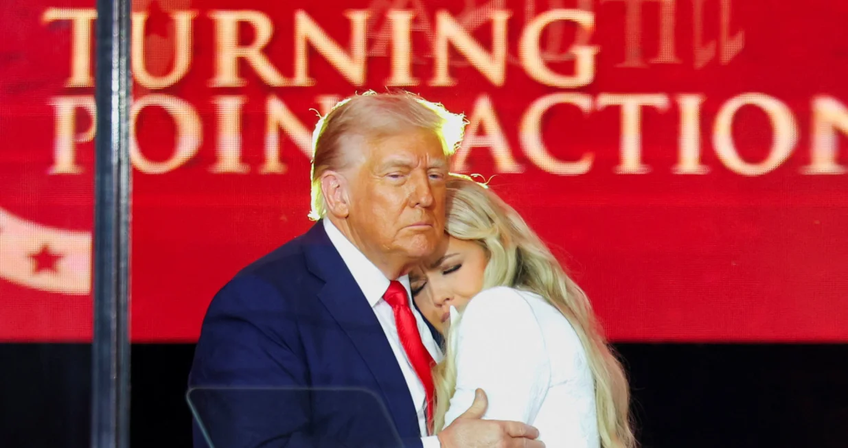 U.S. President Donald Trump embraces Erika Kirk, Charlie Kirk's widow, during a memorial service for slain conservative commentator Charlie Kirk at State Farm Stadium, in Glendale, Arizona, U.S., September 21, 2025. REUTERS/Daniel Cole/Daniel Cole