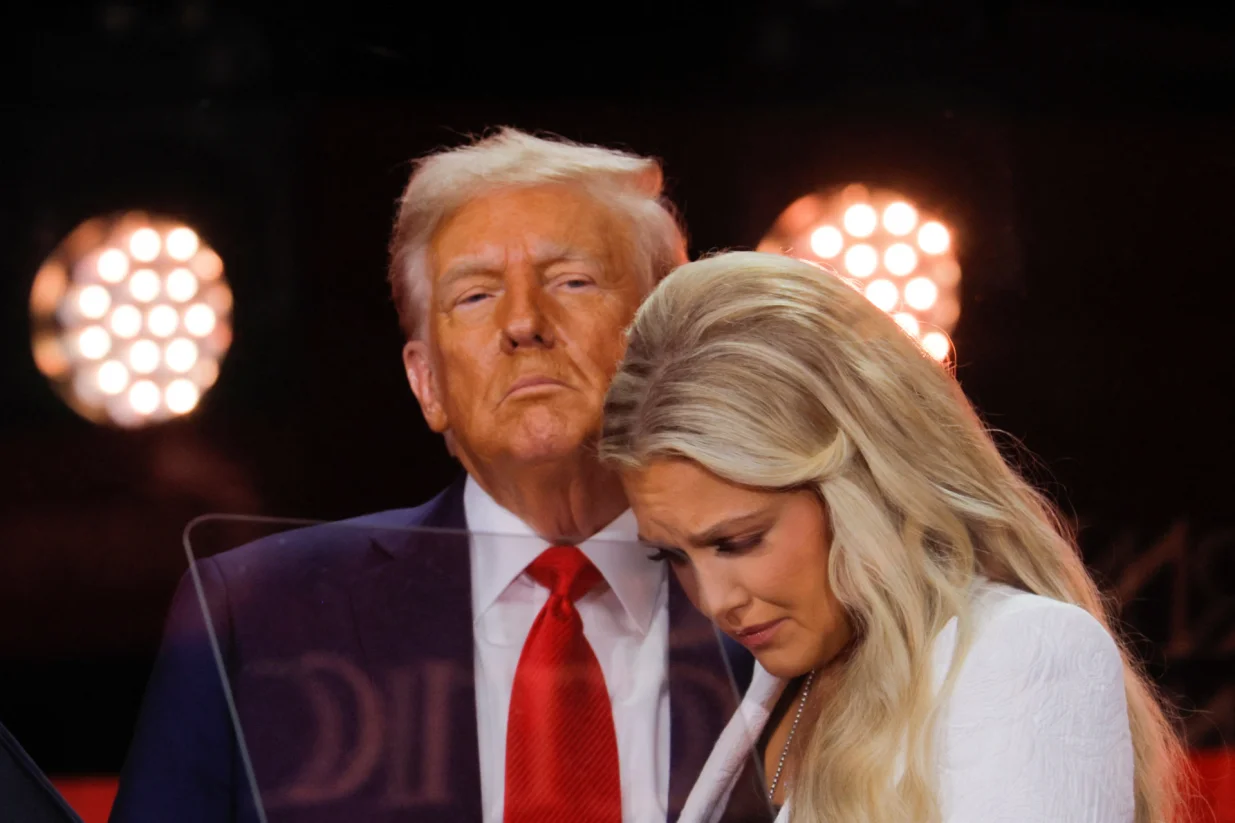 Erika Kirk, wife of slain conservative commentator Charlie Kirk and the new CEO of Turning Point USA, reacts next to U.S. President Donald Trump during a memorial service at State Farm Stadium, in Glendale, Arizona, U.S., September 21, 2025. REUTERS/Brian Snyder/Brian Snyder
