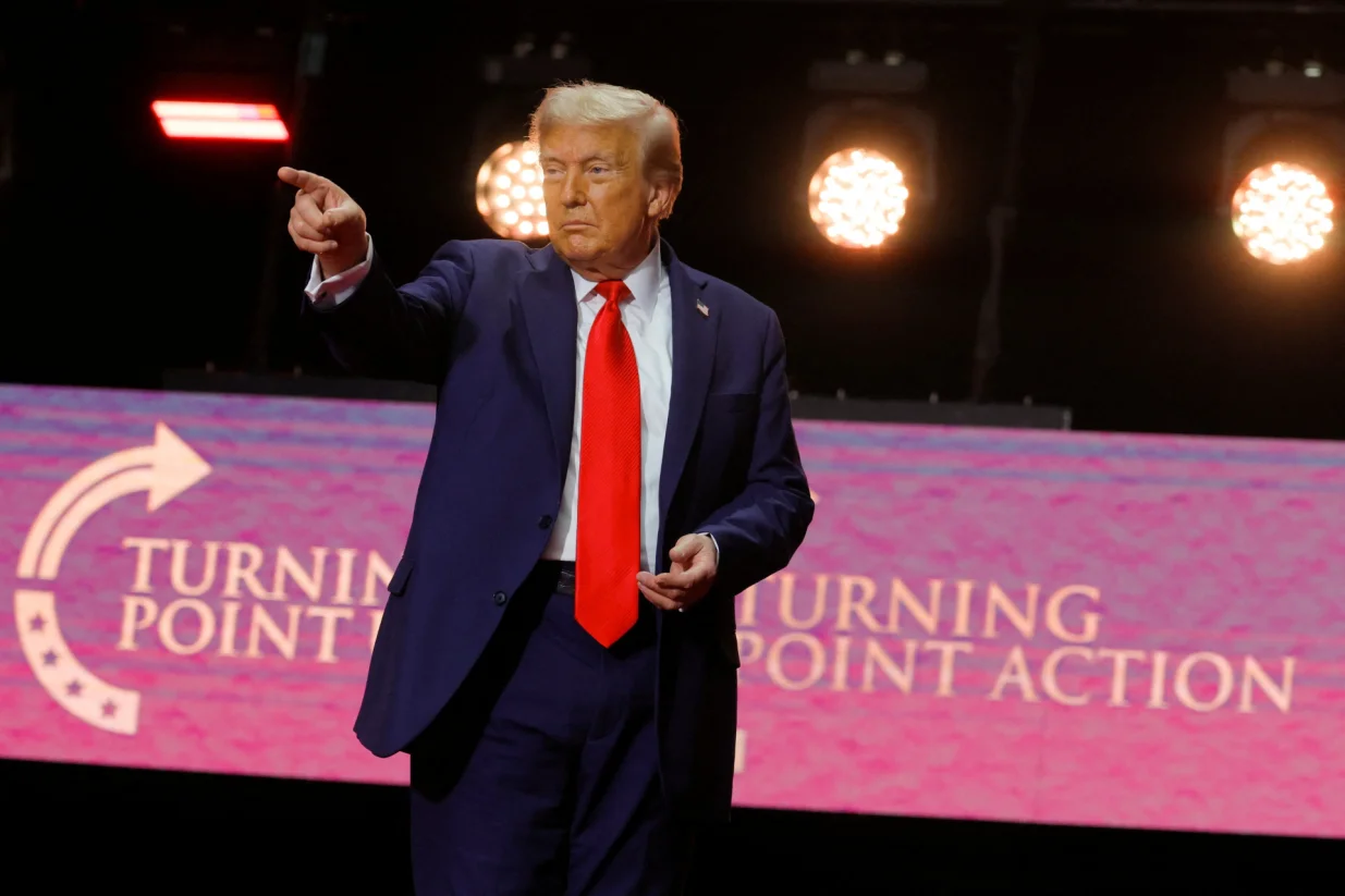 U.S. President Donald Trump gestures after delivering remarks during a memorial service at State Farm Stadium in Glendale, Arizona, U.S., September 21, 2025. REUTERS/Brian Snyder/Brian Snyder