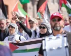 People participate in a demonstration called, "All of Denmark on the streets for a free Palestine", in support of Palestinian in Gaza, amid the ongoing conflict between Israel and Hamas, in the streets of Copenhagen, Denmark August 24, 2025. Ritzau Scanpix/Emil Helms via REUTERS ATTENTION EDITORS - THIS IMAGE WAS PROVIDED BY A THIRD PARTY. DENMARK OUT. NO COMMERCIAL OR EDITORIAL SALES IN DENMARK./Emil Helms