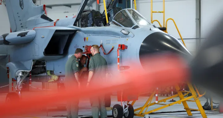 FILE PHOTO: Members of the military work on PA-200 Tornado combat aircraft at an air base of German army Bundeswehr, in Buechel, Germany, July 18, 2024. REUTERS/Thilo Schmuelgen/File Photo/Thilo Schmuelgen