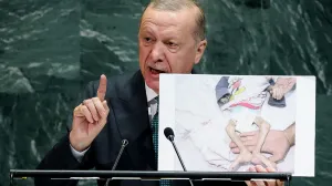 Turkey's President Tayyip Erdogan shows a picture as he addresses the 80th United Nations General Assembly at U.N. headquarters in New York, U.S., September 23, 2025. REUTERS/MIKE SEGAR/Mike Segar