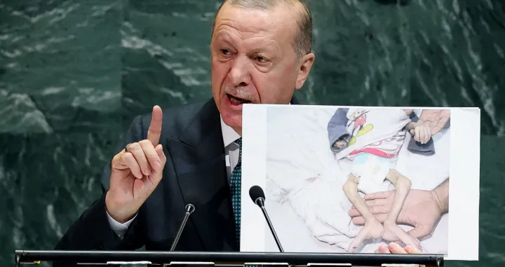 Turkey's President Tayyip Erdogan shows a picture as he addresses the 80th United Nations General Assembly at U.N. headquarters in New York, U.S., September 23, 2025. REUTERS/MIKE SEGAR/Mike Segar