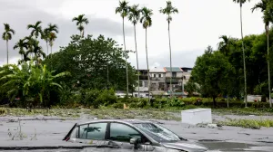 A car is partially submerged following flooding brought by Super Typhoon Ragasa in Hualien, Taiwan, September 24, 2025. REUTERS/Ann Wang/Ann Wang