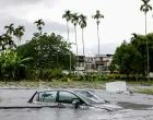 A car is partially submerged following flooding brought by Super Typhoon Ragasa in Hualien, Taiwan, September 24, 2025. REUTERS/Ann Wang/Ann Wang