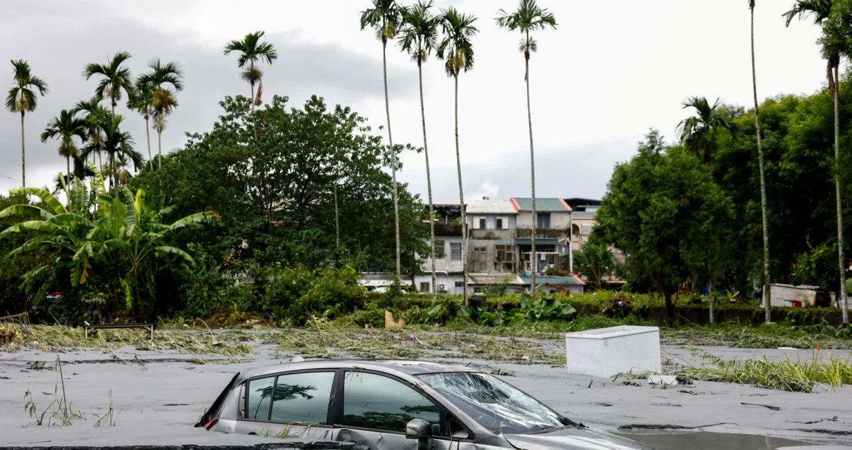 A car is partially submerged following flooding brought by Super Typhoon Ragasa in Hualien, Taiwan, September 24, 2025. REUTERS/Ann Wang/Ann Wang