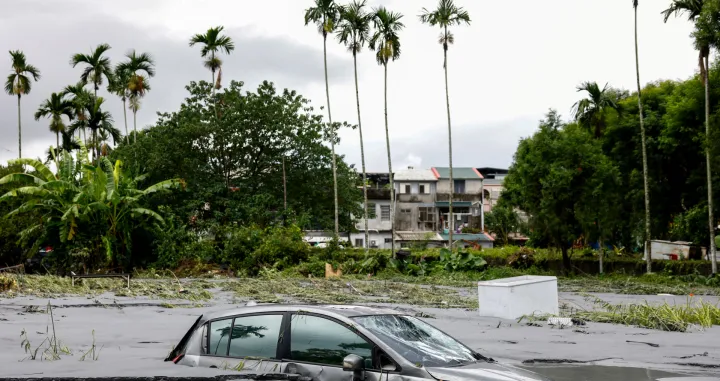 A car is partially submerged following flooding brought by Super Typhoon Ragasa in Hualien, Taiwan, September 24, 2025. REUTERS/Ann Wang/Ann Wang