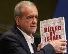 Iran's President Masoud Pezeshkian holds a book as he addresses the 80th United Nations General Assembly (UNGA) at the U.N. headquarters in New York, U.S., September 24, 2025. REUTERS/Shannon Stapleton/Shannon Stapleton
