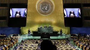 Palestinian President Mahmoud Abbas appears on screens as he addresses the 80th United Nations General Assembly (UNGA), at the U.N. headquarters in New York, U.S., September 25, 2025. REUTERS/Jeenah Moon/Jeenah Moon