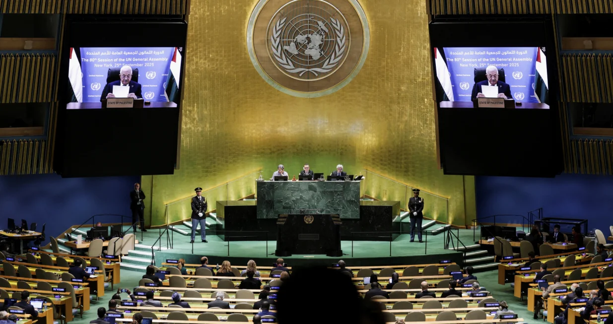 Palestinian President Mahmoud Abbas appears on screens as he addresses the 80th United Nations General Assembly (UNGA), at the U.N. headquarters in New York, U.S., September 25, 2025. REUTERS/Jeenah Moon/Jeenah Moon