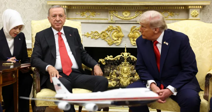 U.S. President Donald Trump listens as Turkey's President Recep Tayyip Erdogan's interpreter speaks during a meeting in the Oval Office at the White House in Washington, D.C., U.S., September 25, 2025. REUTERS/Kevin Lamarque/Kevin Lamarque