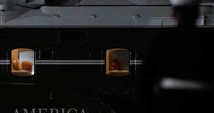 U.S. President Donald Trump and first Lady Melania Trump sit on board Marine One, after attending the 80th United Nations General Assembly, at John F. Kennedy International Airport, in New York, U.S., September 23, 2025. REUTERS/Al Drago/Alexander Drago