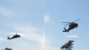 Swedish Army Blackhawk helicopters prepare to land at the Tofta firing range on Gotland, Sweden, September 24, 2025. REUTERS/Tom Little/Tom Little