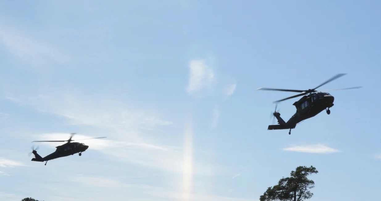 Swedish Army Blackhawk helicopters prepare to land at the Tofta firing range on Gotland, Sweden, September 24, 2025. REUTERS/Tom Little/Tom Little