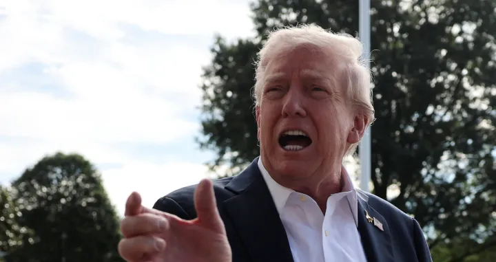 U.S. President Donald Trump speaks to the media before departing for travel to New York to attend the Ryder Cup golf tournament, from the White House in Washington, D.C., U.S., September 26, 2025 REUTERS/Jonathan Ernst/Jonathan Ernst