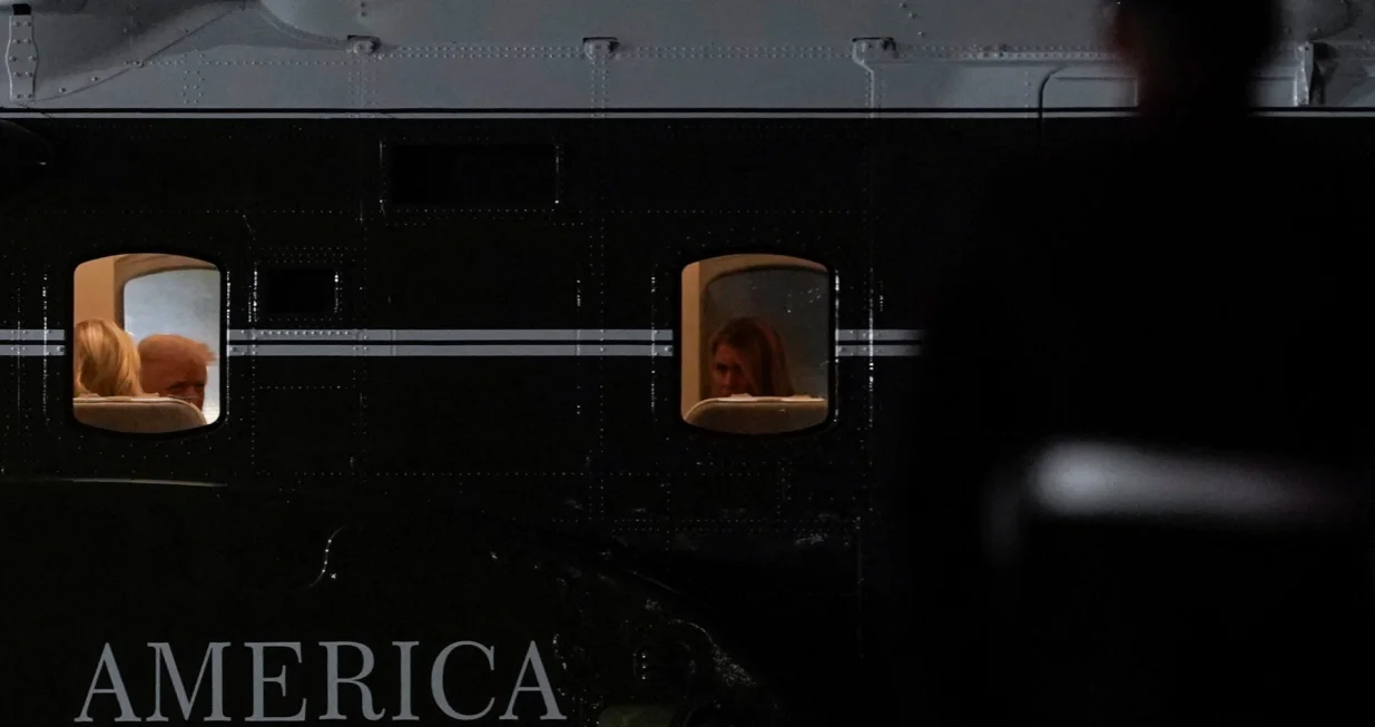 U.S. President Donald Trump and first Lady Melania Trump sit on board Marine One, after attending the 80th United Nations General Assembly, at John F. Kennedy International Airport, in New York, U.S., September 23, 2025. REUTERS/Al Drago/Alexander Drago