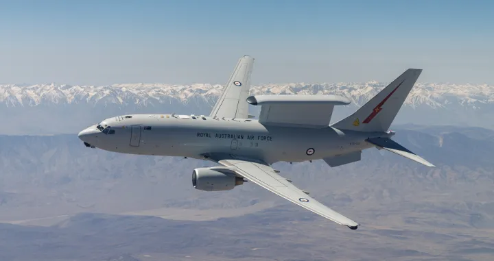 A Royal Australian Air Force E-7A Wedgetail soars over Southern California. Aircrews from the USAF, RAAF, and Royal Air Force worked together to rapidly certify the RAAF E-7A with the United States Air Force KC-46A. The trilateral test also allowed the United Kingdom and United States Air Force to gain early test experience ahead of their anticipated fielding of E-7 aircraft variants. (Air Force photo by Richard Gonzales)/Richard Gonzales