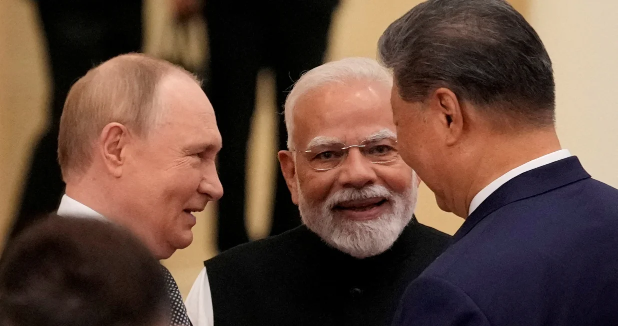 FILE PHOTO: Indian Prime Minister Narendra Modi talks with Russian President Vladimir Putin and Chinese President Xi Jinping ahead of the Shanghai Cooperation Organization (SCO) Summit 2025 at the Meijiang Convention and Exhibition Centre in Tianjin, China, September 1, 2025. SUO TAKEKUMA/Pool via REUTERS/File Photo/Suo Takekuma